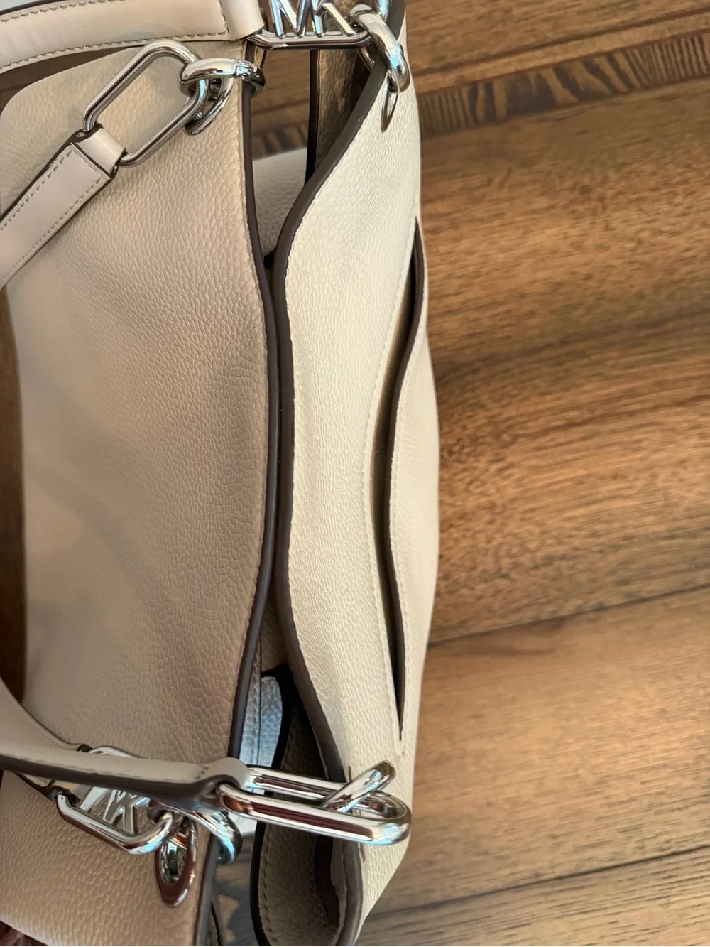 Michael Kors Raven pebbled leather shoulder bag featuring silver-tone hardware